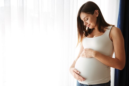 Pregnant Lady with Maternity Cover Abroad