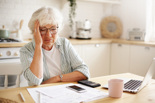 Old Woman Stressed Out by Medical Health Insurance